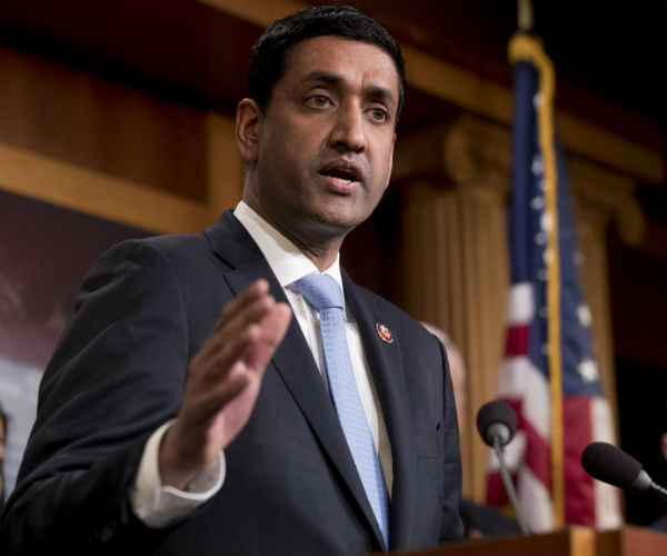 ro khanna is shown with the american flag in the background